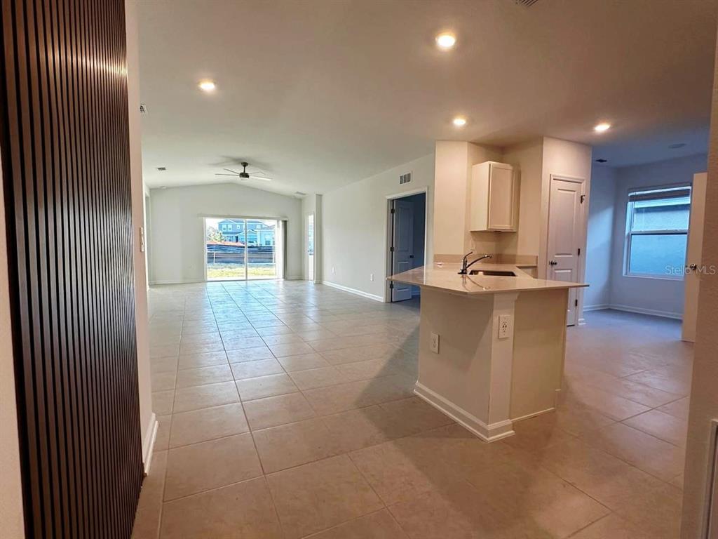 339 Puma Loop Groveland, FL 34736 - Photo 9 of 23 a lobby with stainless steel appliances with kitchen view