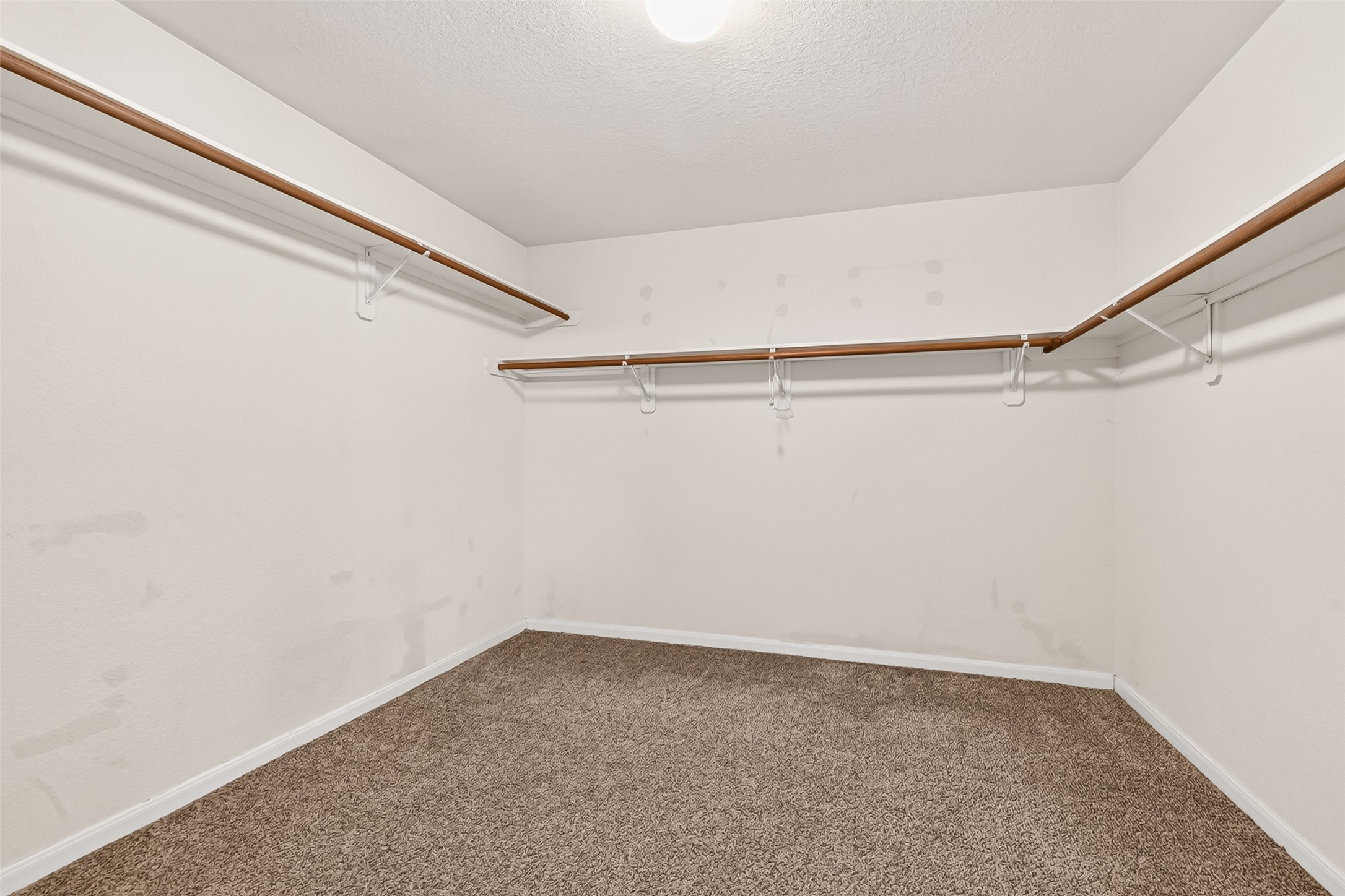 16715 Mackenzie Mesa Drive Spring, TX 77379 - Photo 37 of 50 a view of a room with empty racks