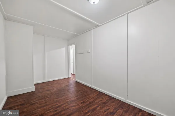 a view of room with wooden floor