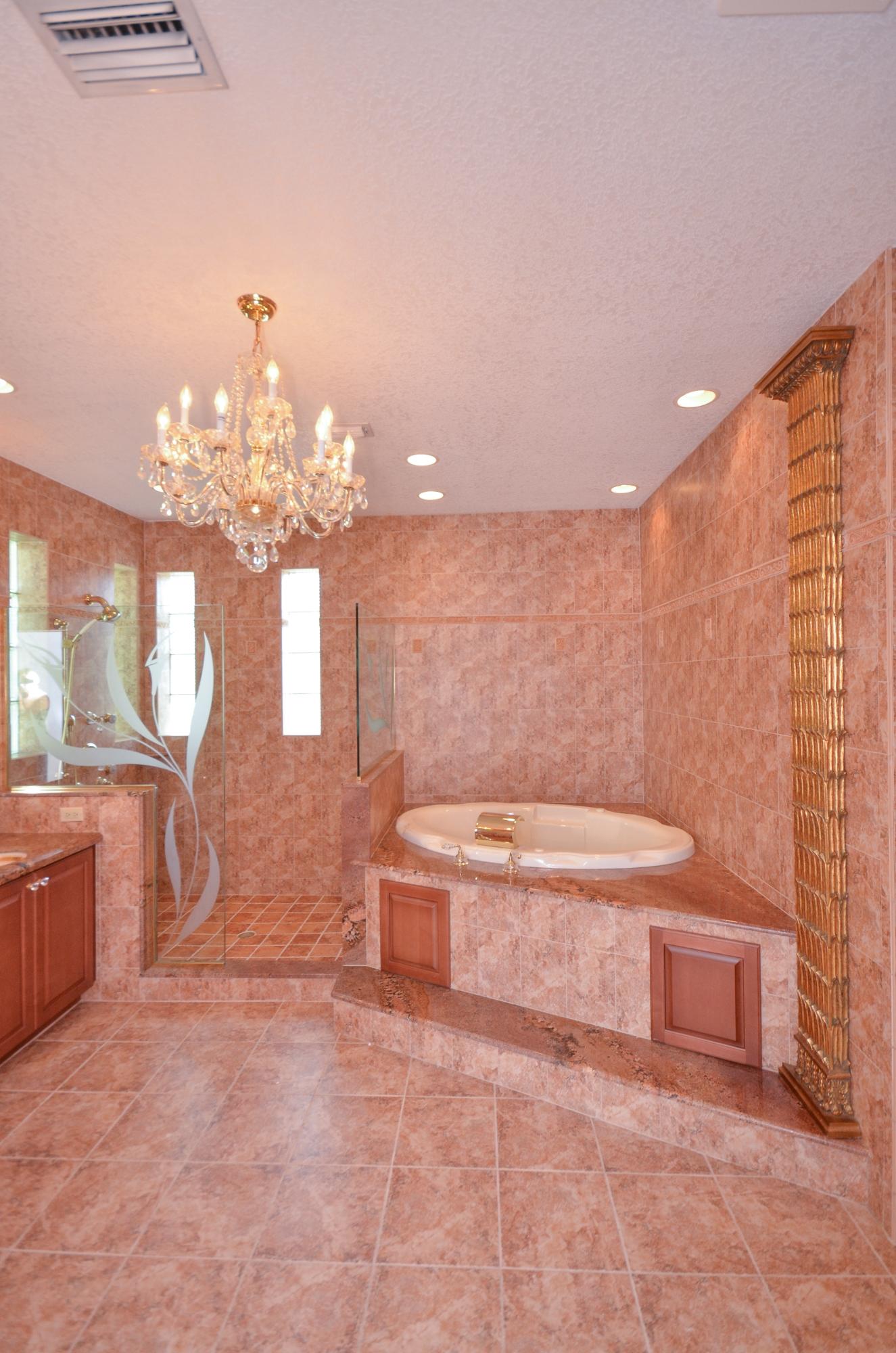 10873 Ravel Court Boca Raton, FL 33498 - Photo 12 of 18 a bathroom with a toilet sink and mirror