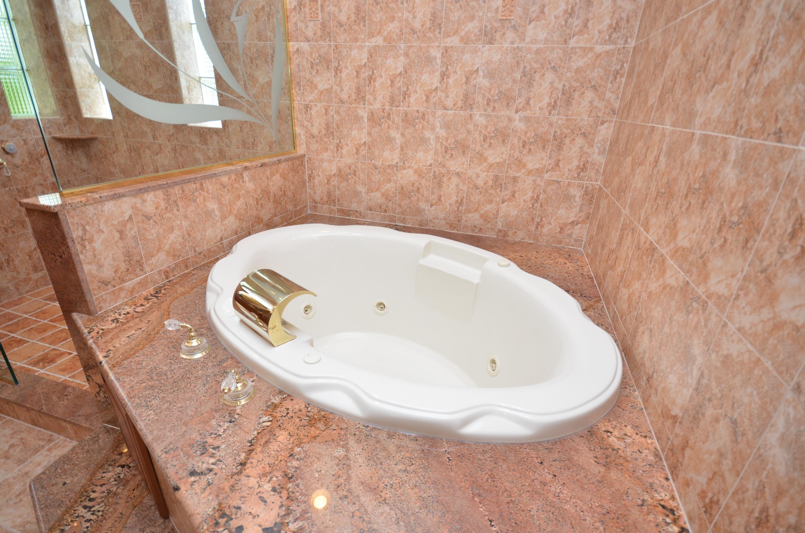 10873 Ravel Court Boca Raton, FL 33498 - Photo 13 of 18 a view of a bathtub in a bathroom