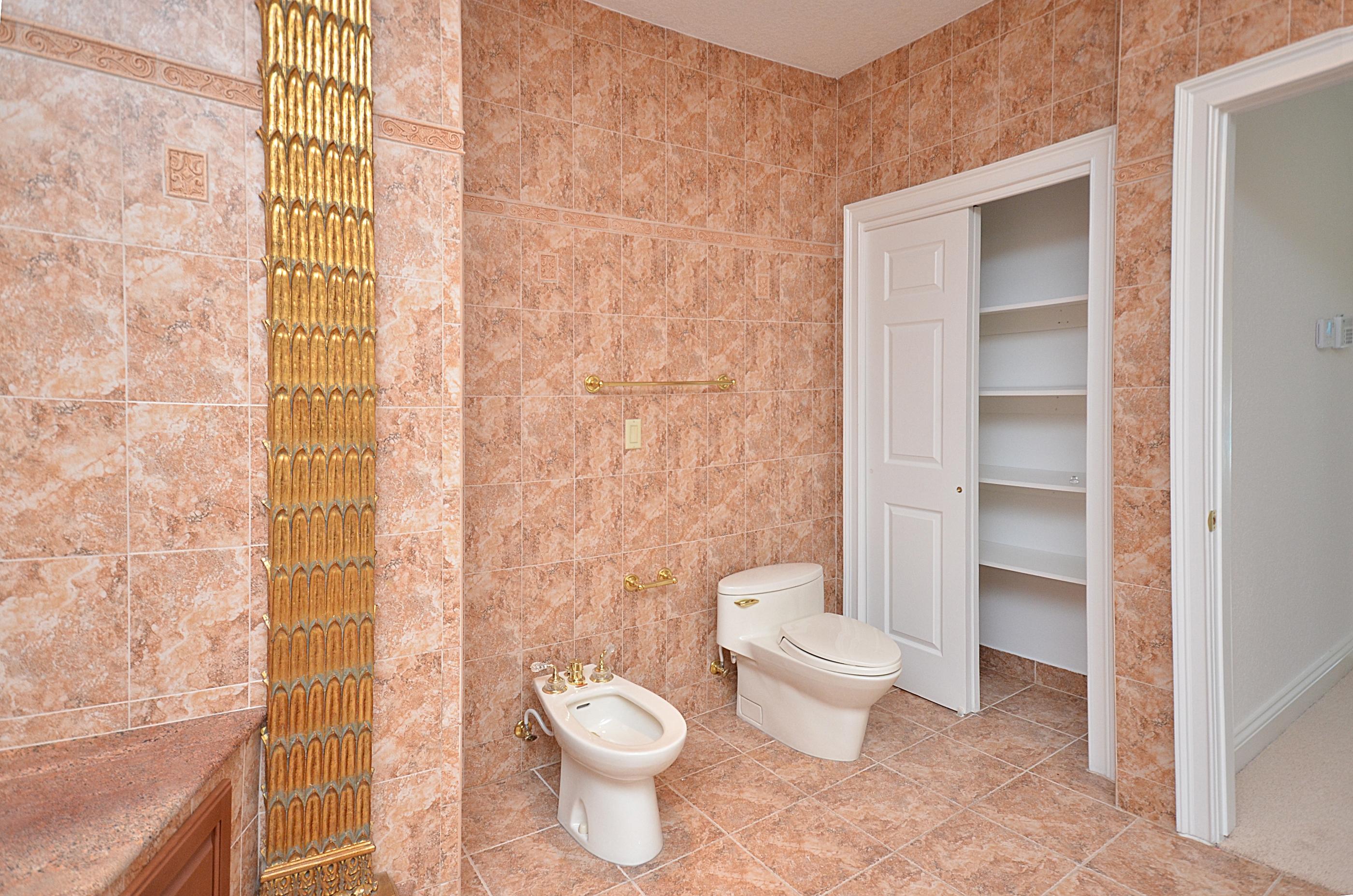 10873 Ravel Court Boca Raton, FL 33498 - Photo 14 of 18 a bathroom with a toilet and a shower