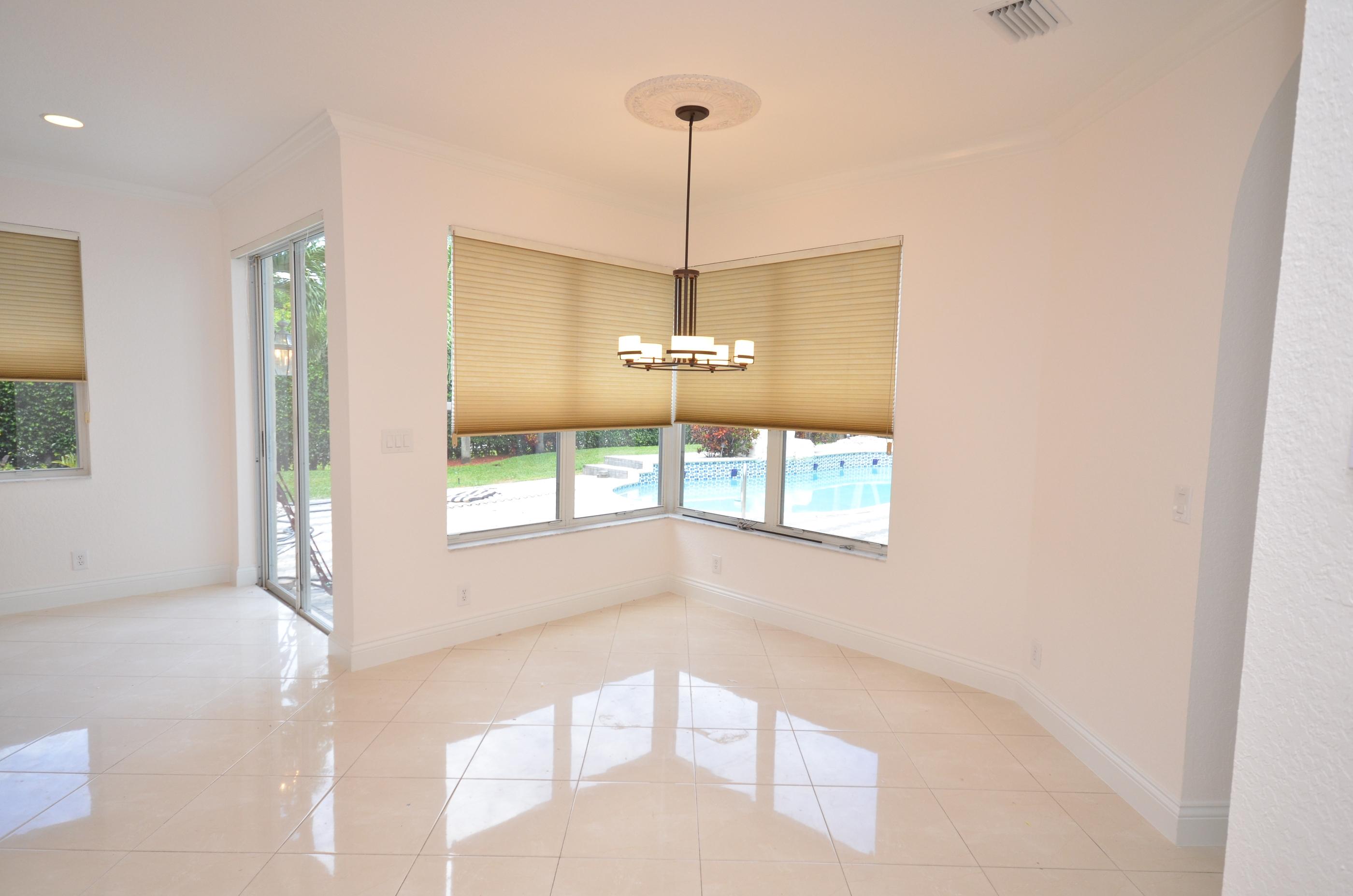 10873 Ravel Court Boca Raton, FL 33498 - Photo 9 of 18 a very nice looking room with a window