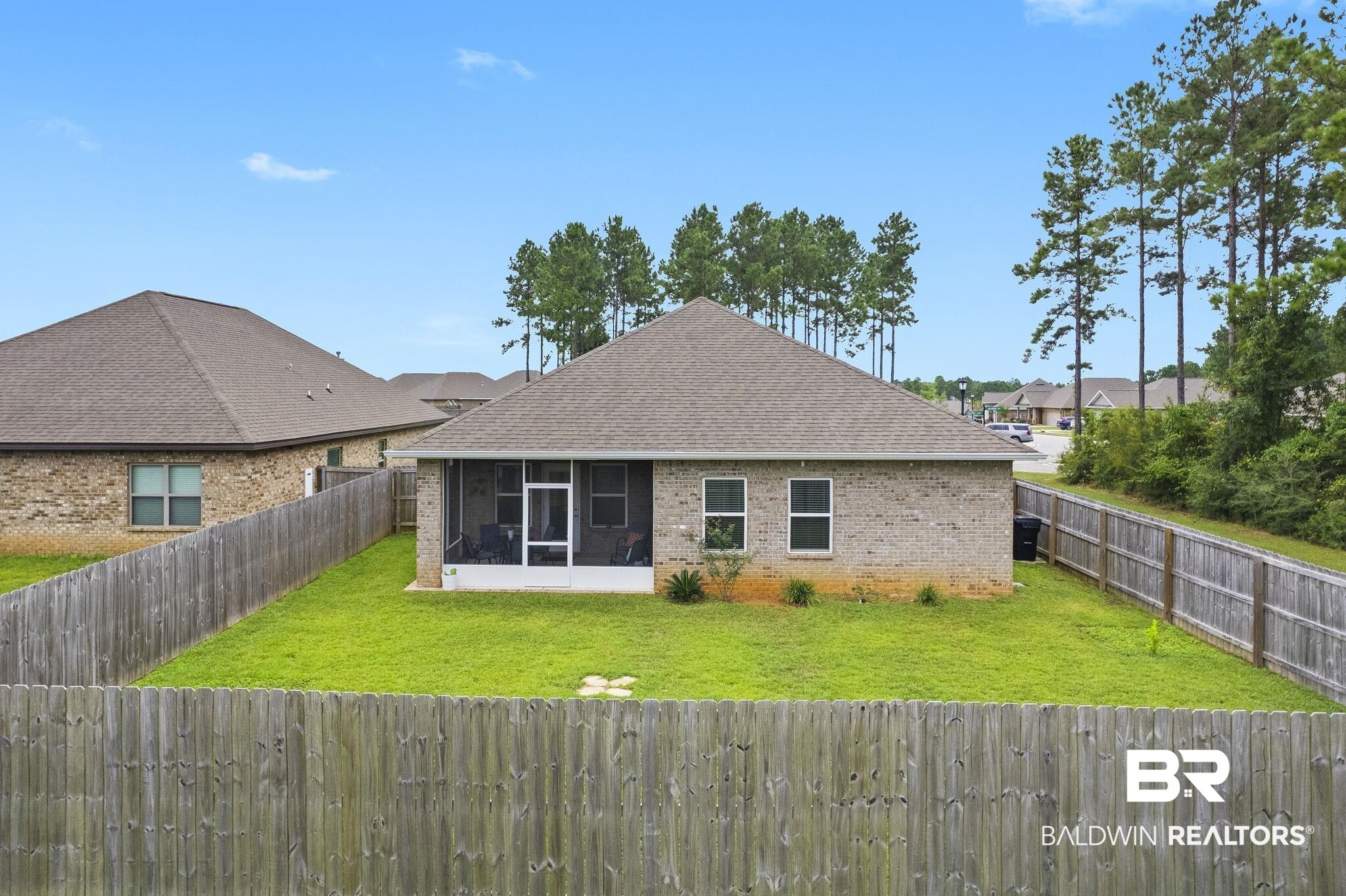 31643 Kestrel Loop Daphne, AL 36527 - Photo 40 of 59 View of front facade featuring a front yard and a sunroom