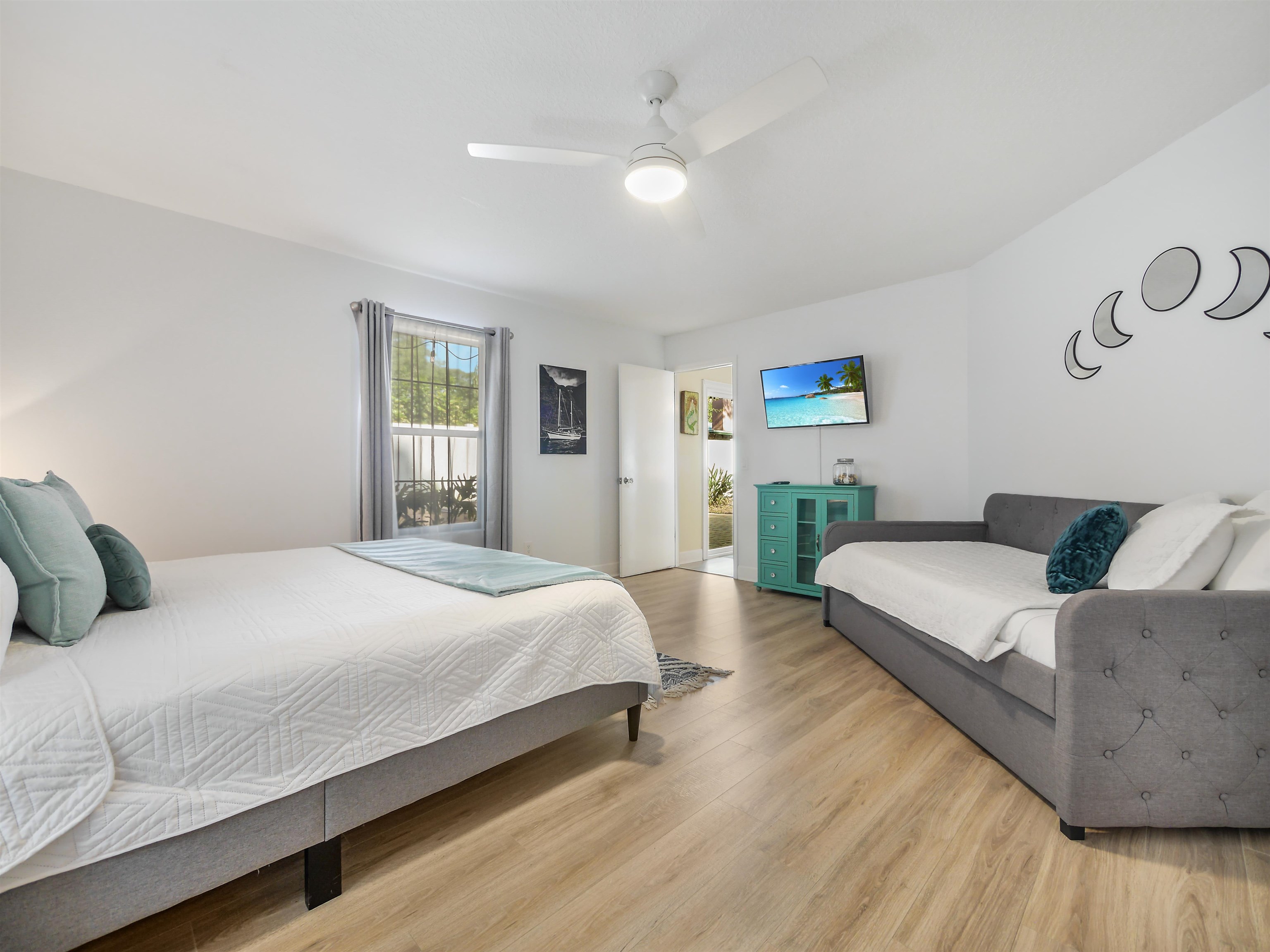 140 Hawthorne Road St. Augustine, FL 32086 - Photo 14 of 39 a bedroom with a large bed wooden floor and window