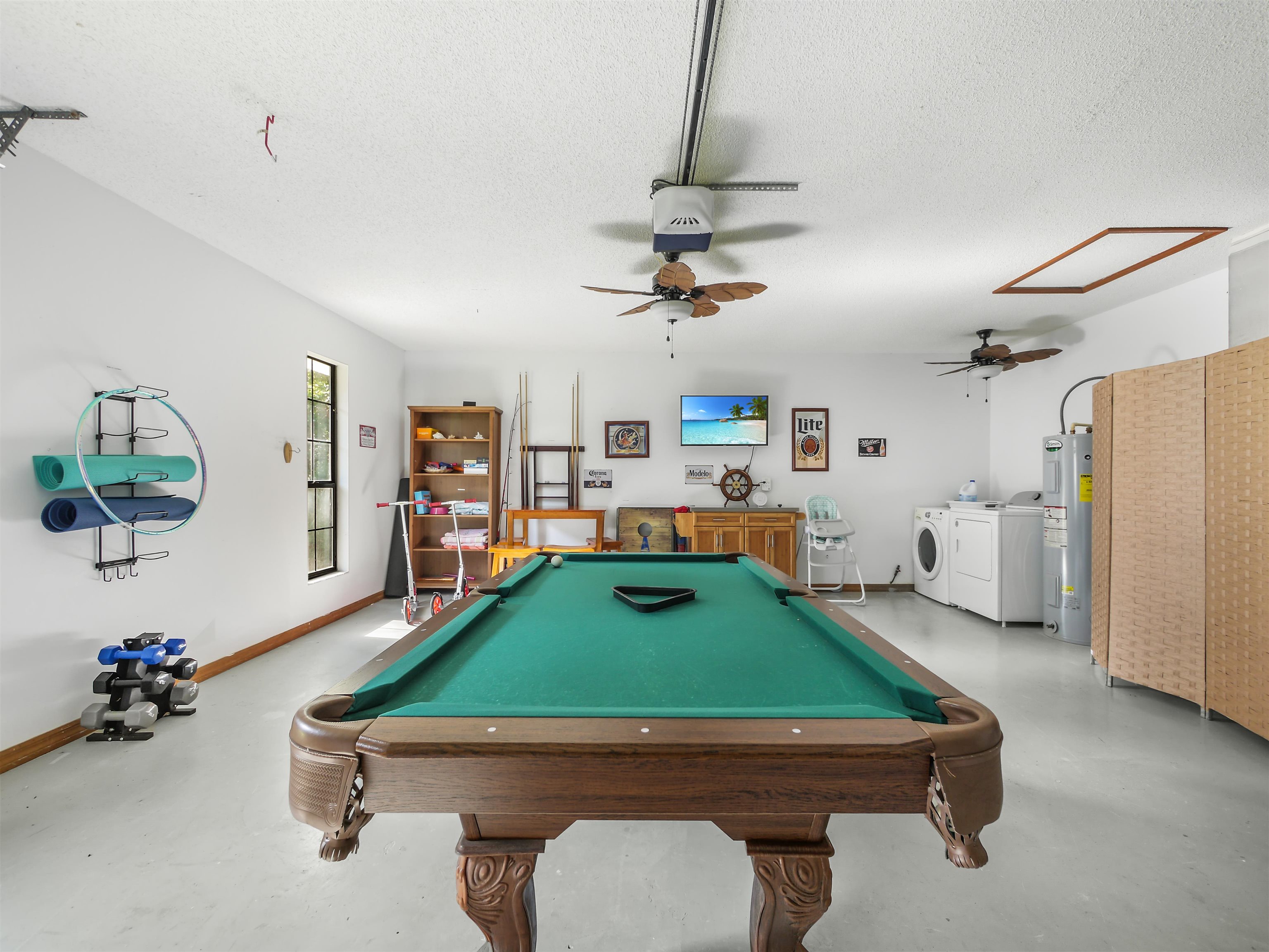 140 Hawthorne Road St. Augustine, FL 32086 - Photo 25 of 39 a room with furniture and a flat screen tv