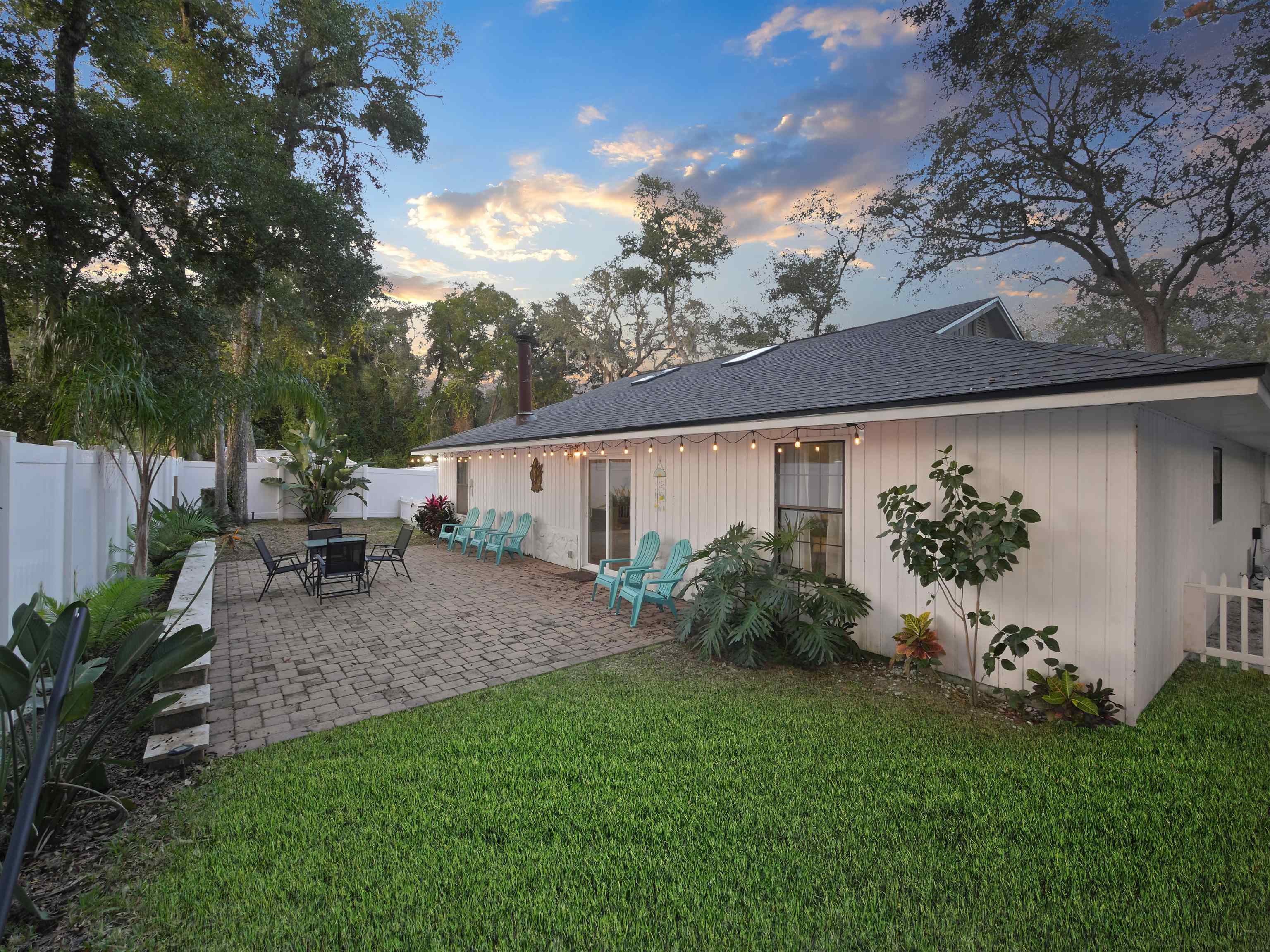 140 Hawthorne Road St. Augustine, FL 32086 - Photo 30 of 39 a view of a backyard with plants and a patio