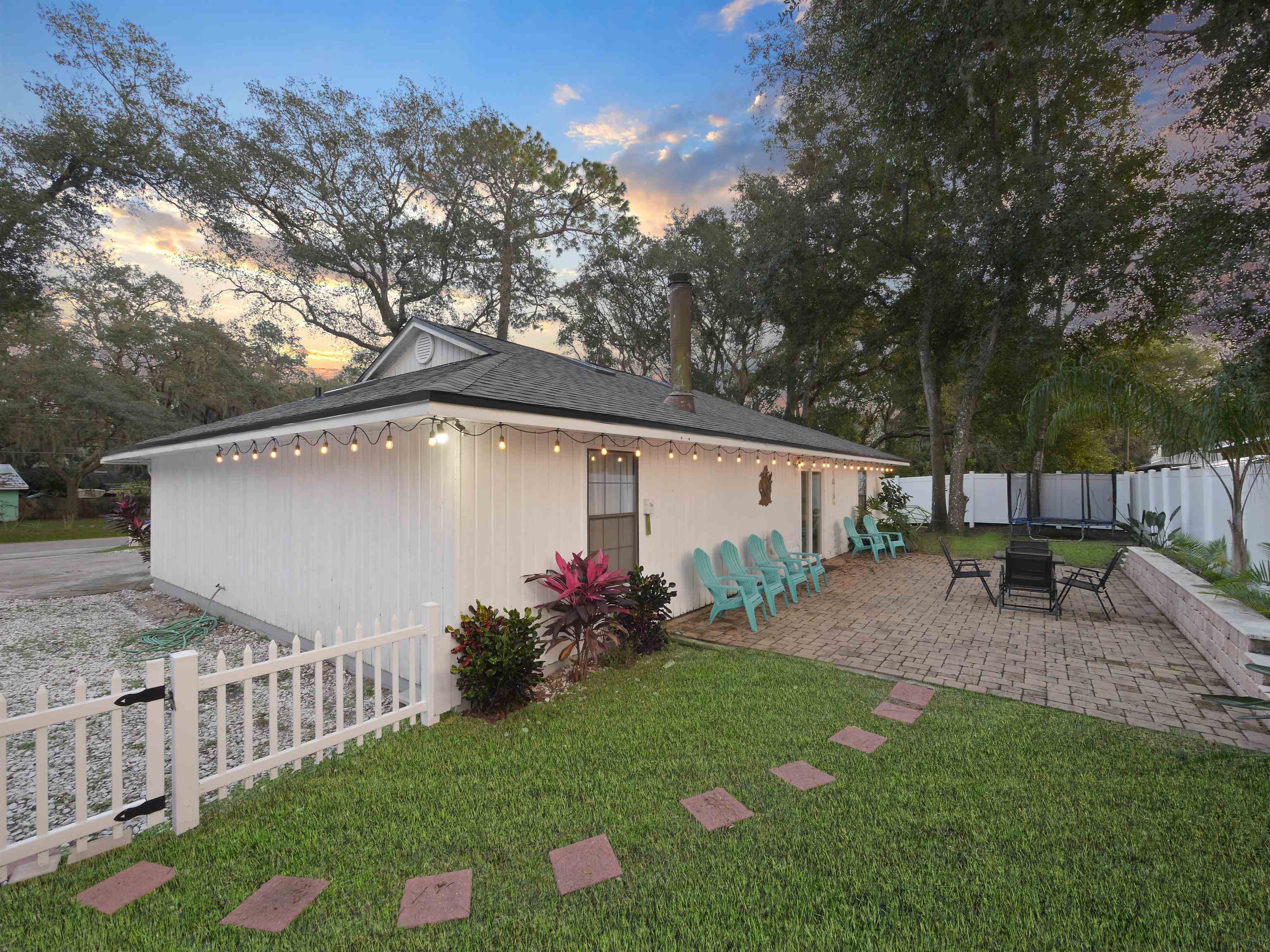 140 Hawthorne Road St. Augustine, FL 32086 - Photo 31 of 39 a view of a chair and table in backyard