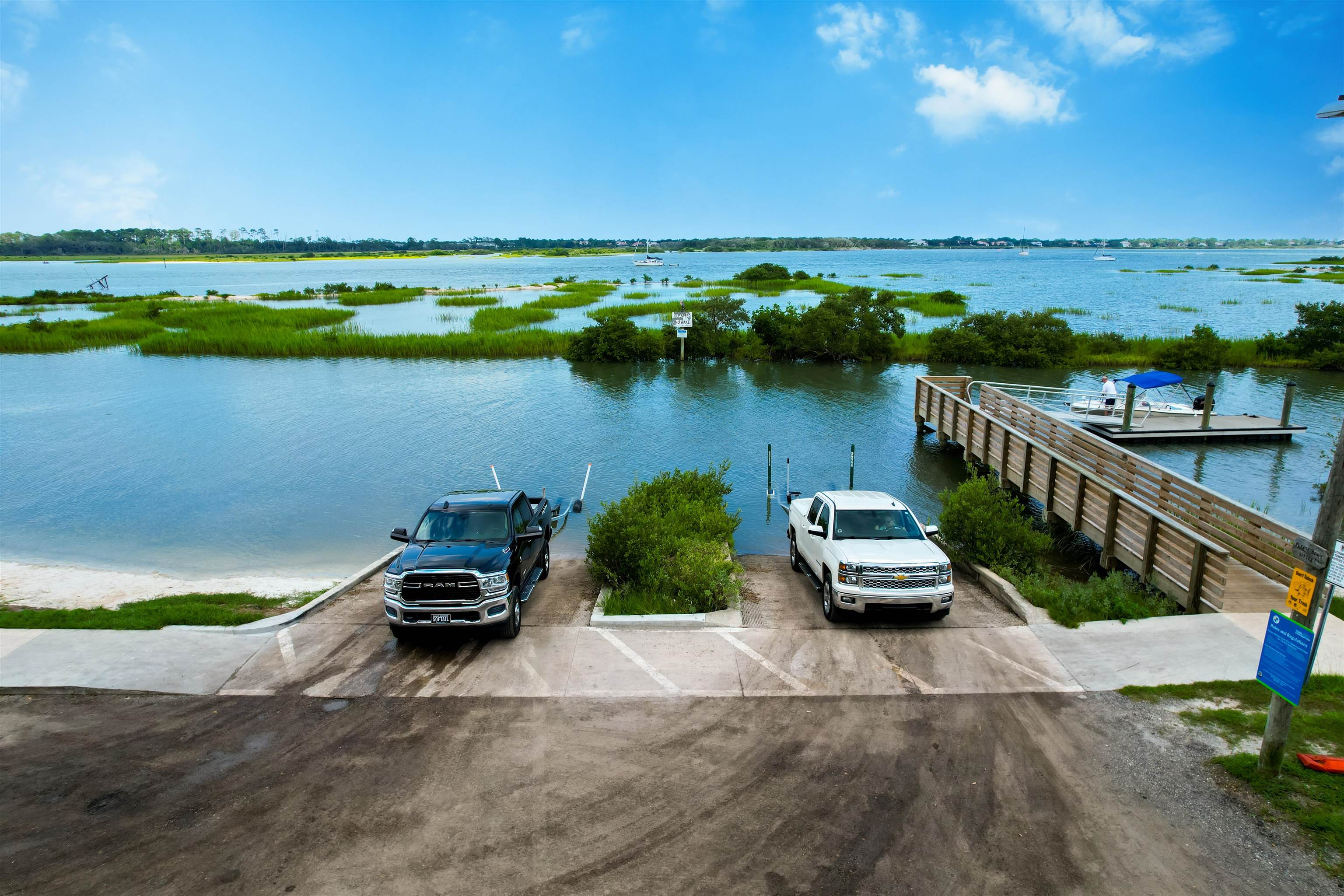 140 Hawthorne Road St. Augustine, FL 32086 - Photo 34 of 39 a car parked on the side of a lake