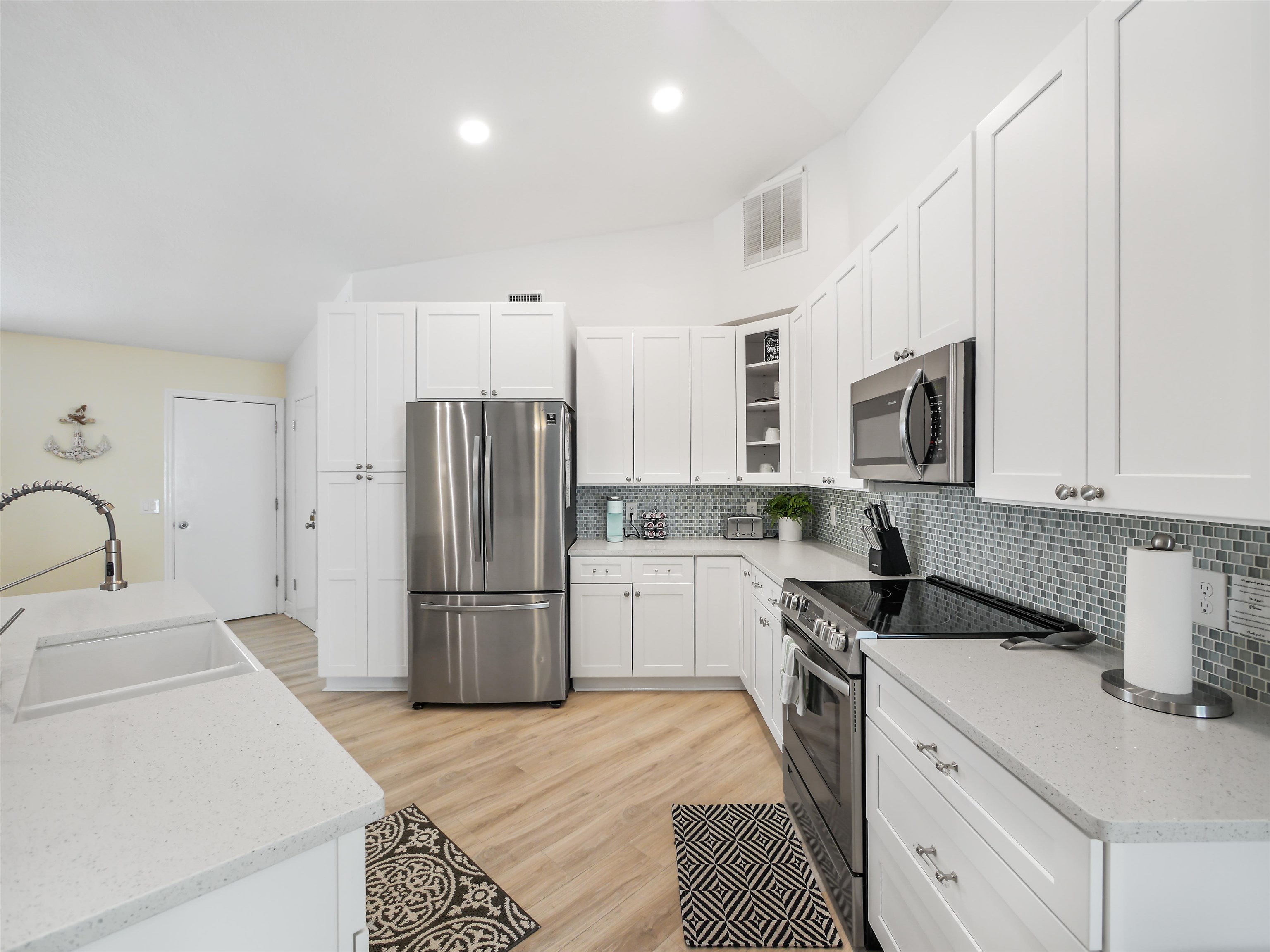 140 Hawthorne Road St. Augustine, FL 32086 - Photo 5 of 39 a kitchen with a refrigerator stove and sink