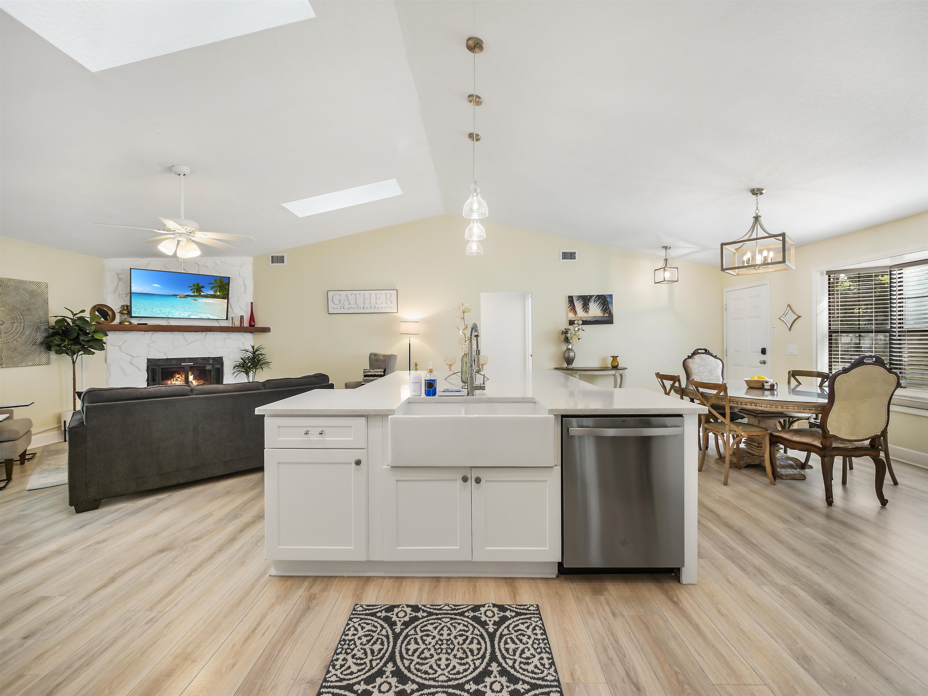 140 Hawthorne Road St. Augustine, FL 32086 - Photo 6 of 39 a large white kitchen with sink stove and refrigerator