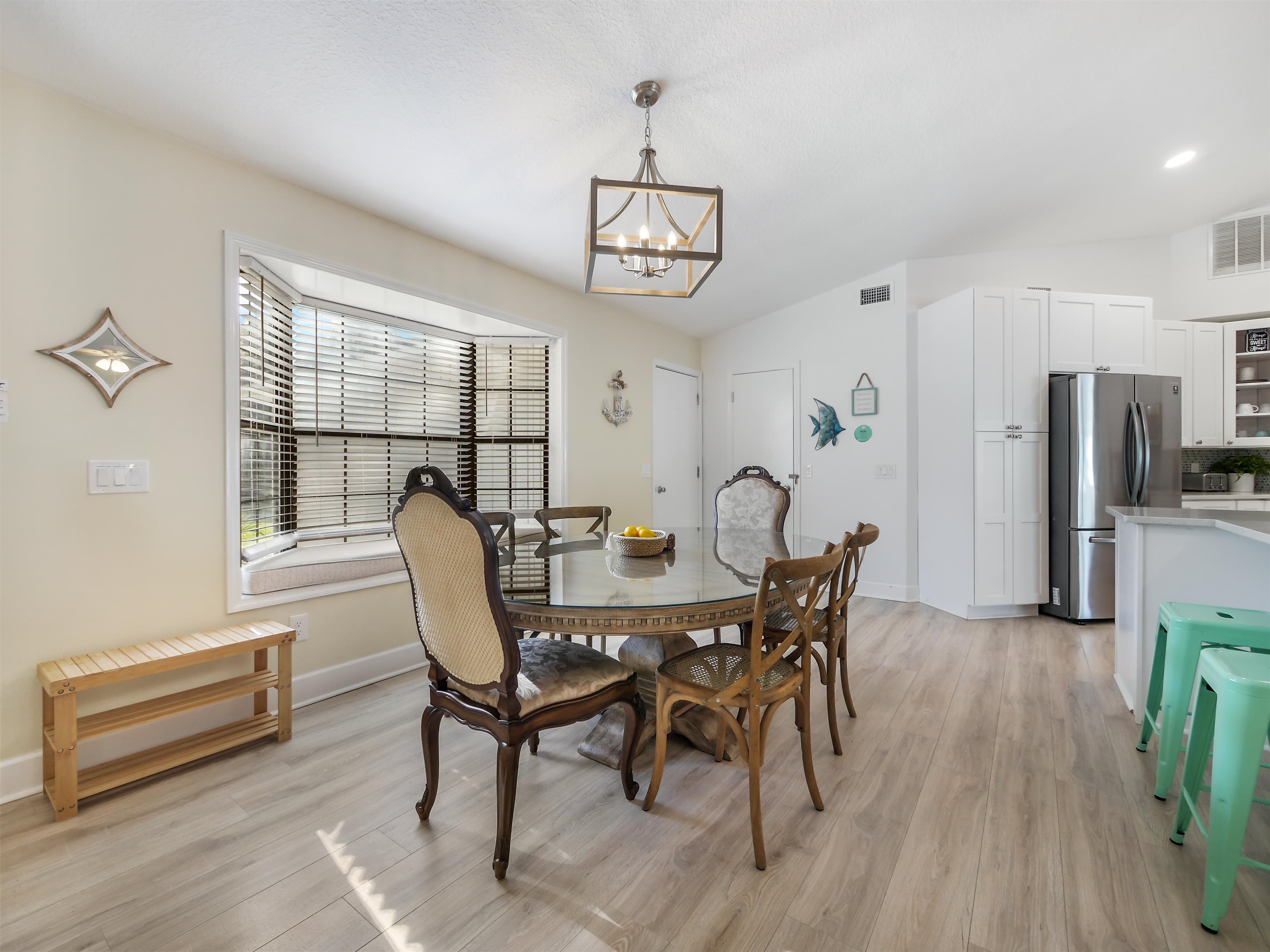 140 Hawthorne Road St. Augustine, FL 32086 - Photo 8 of 39 a view of a dining room with furniture and wooden floor