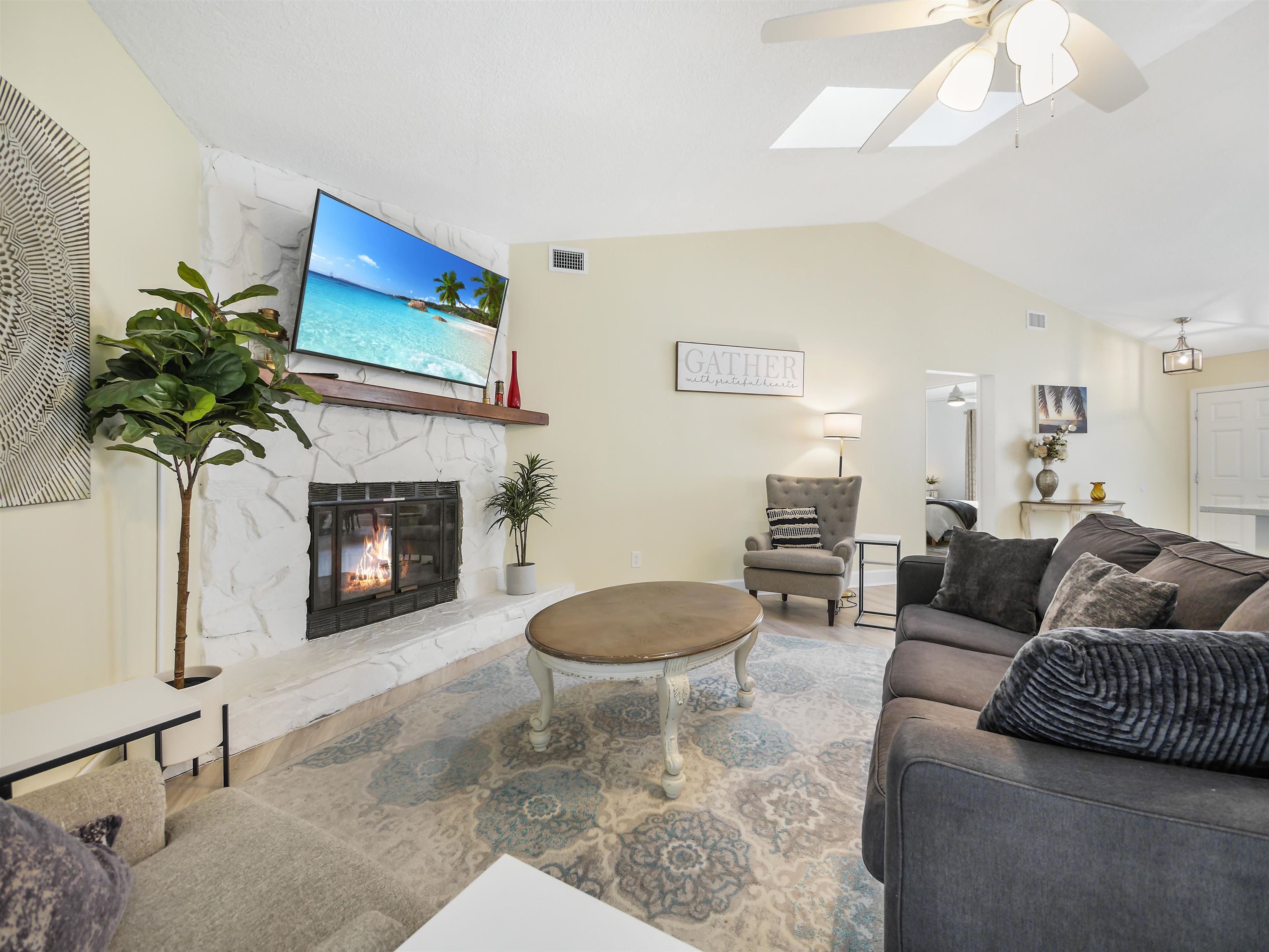 140 Hawthorne Road St. Augustine, FL 32086 - Photo 10 of 39 a living room with furniture a potted plant and a fireplace