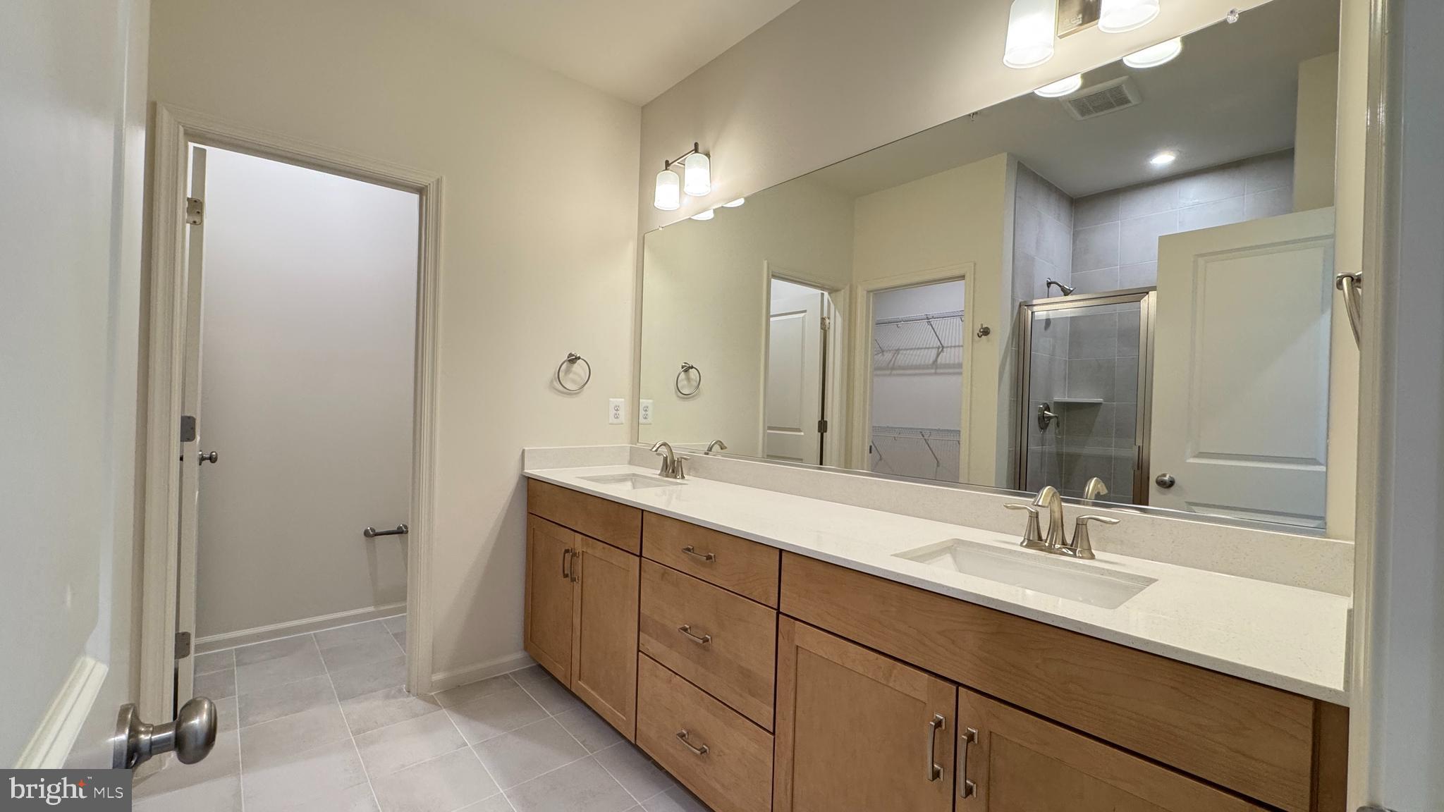 2613 River Birch Road Herndon, VA 20171 - Photo 8 of 14 a bathroom with a double vanity sink mirror and double