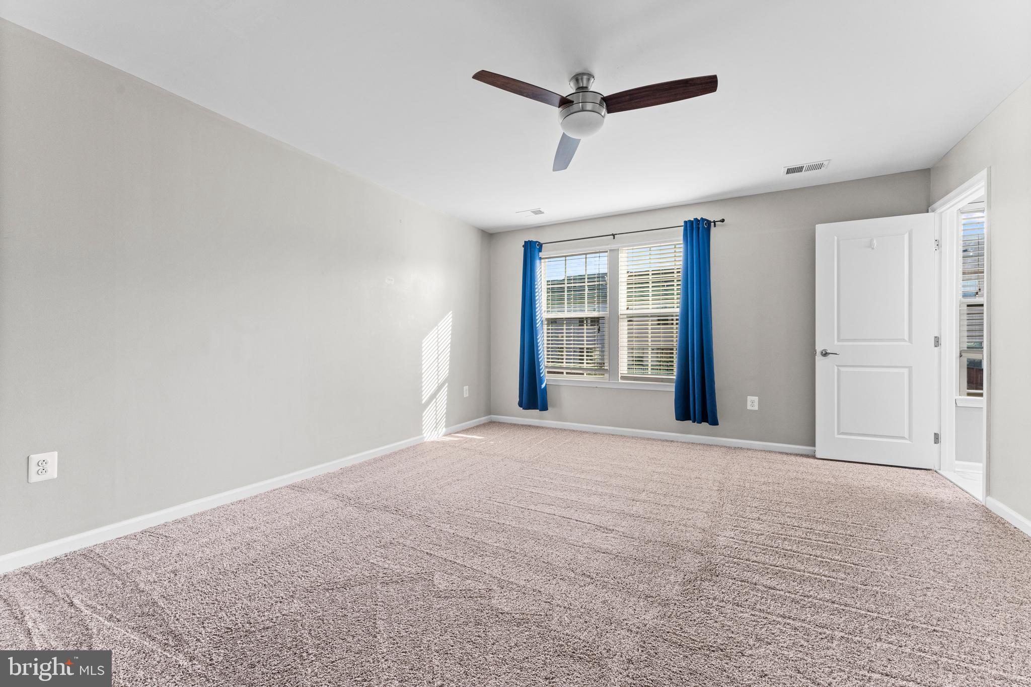 104 Spring Park Lane, Unit 43 Fredericksburg, VA 22405 - Photo 12 of 36 a view of an empty room with a window
