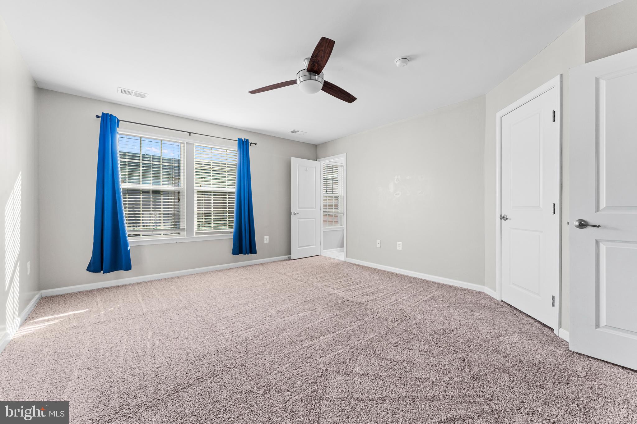 104 Spring Park Lane, Unit 43 Fredericksburg, VA 22405 - Photo 13 of 36 a view of an empty room with a window