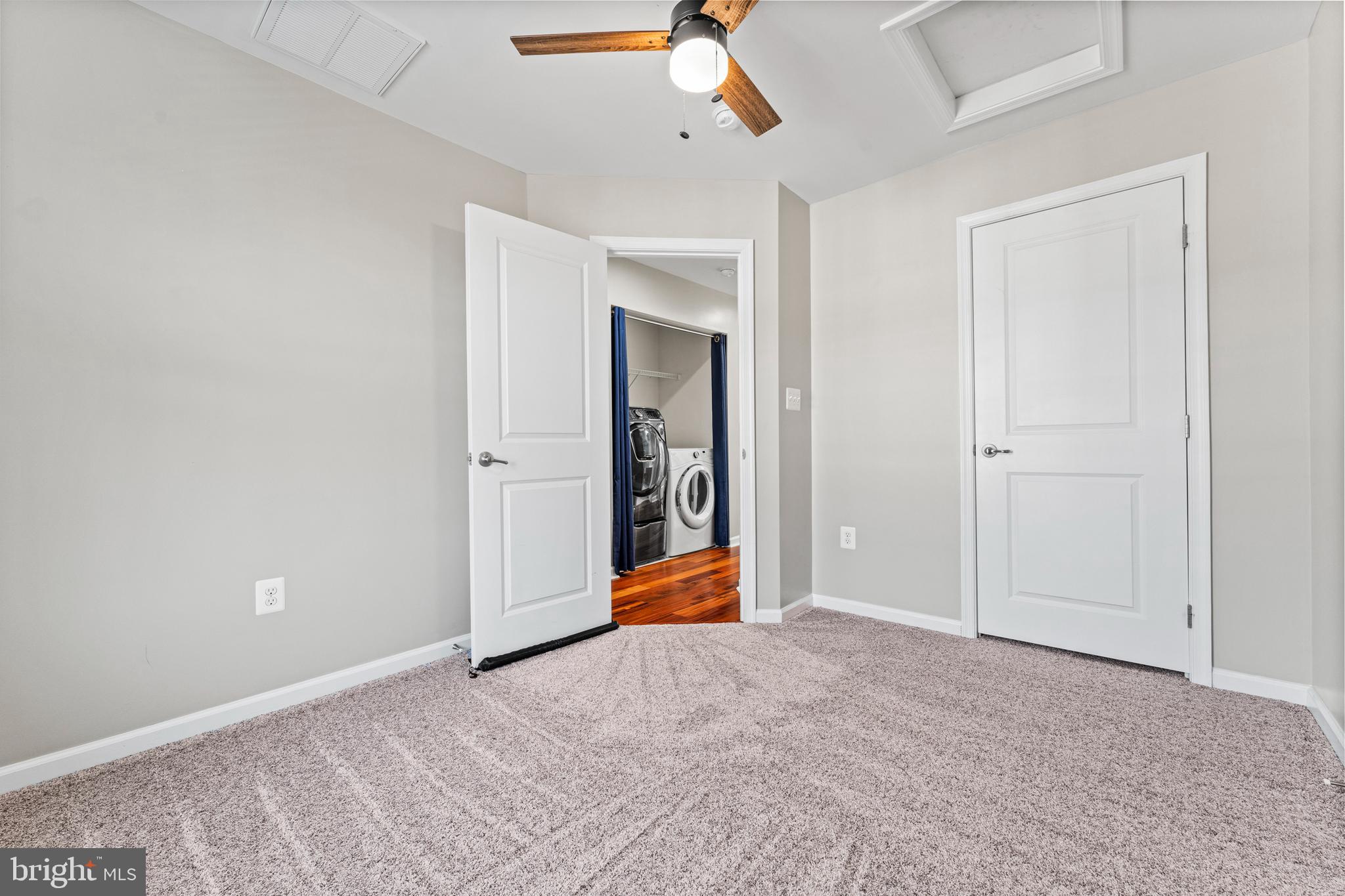 104 Spring Park Lane, Unit 43 Fredericksburg, VA 22405 - Photo 16 of 36 a view of an empty room with a ceiling fan