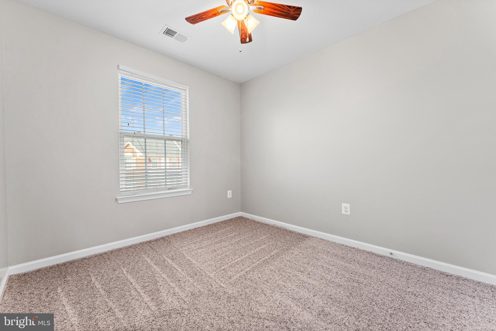 104 Spring Park Lane, Unit 43 Fredericksburg, VA 22405 - Photo 18 of 36 an empty room with a chandelier fan