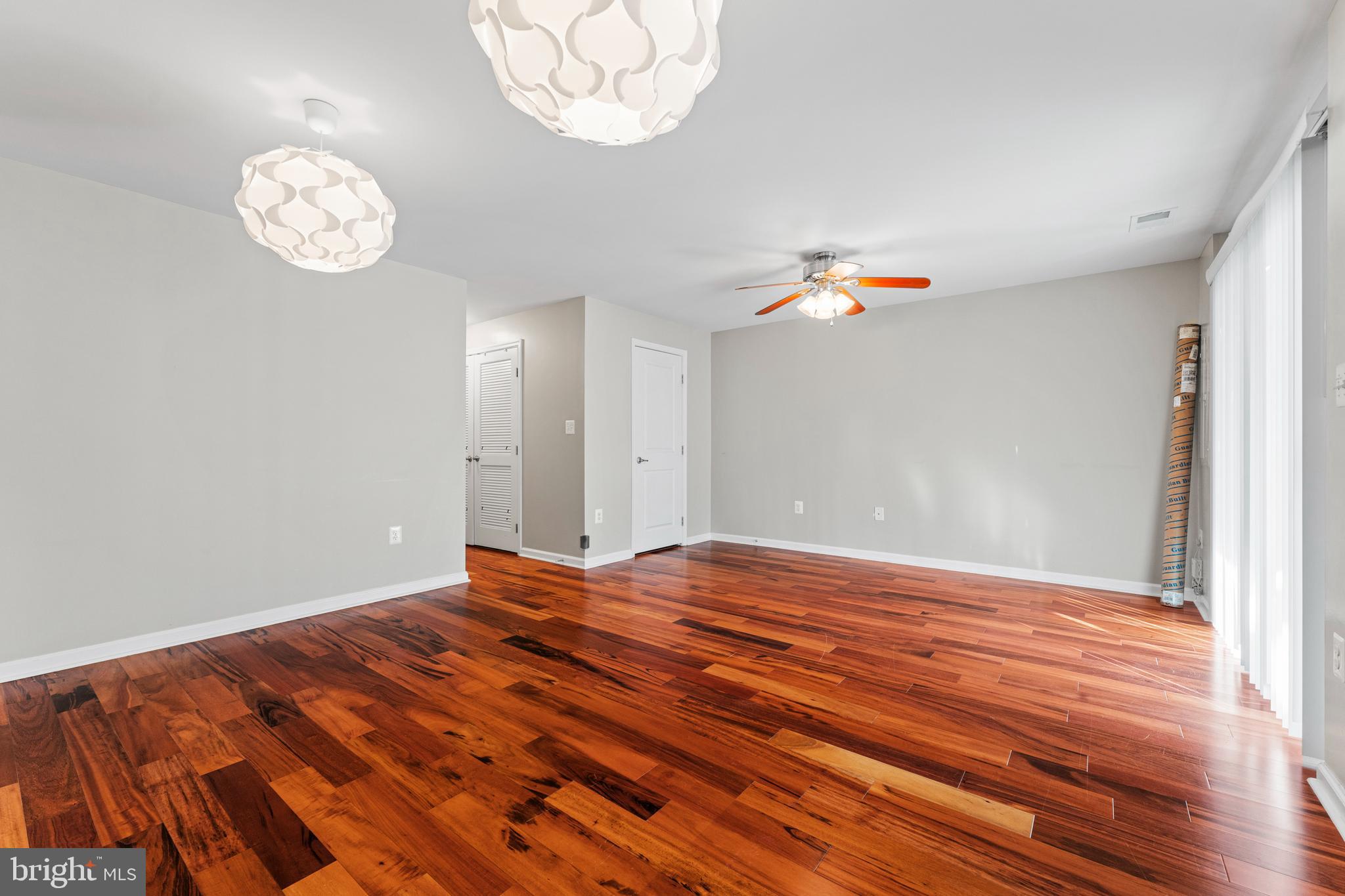 104 Spring Park Lane, Unit 43 Fredericksburg, VA 22405 - Photo 21 of 36 a view of a room with wooden floor and a window