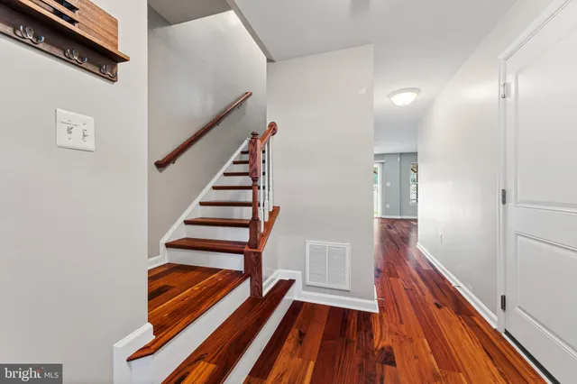 a view of entryway with wooden floor