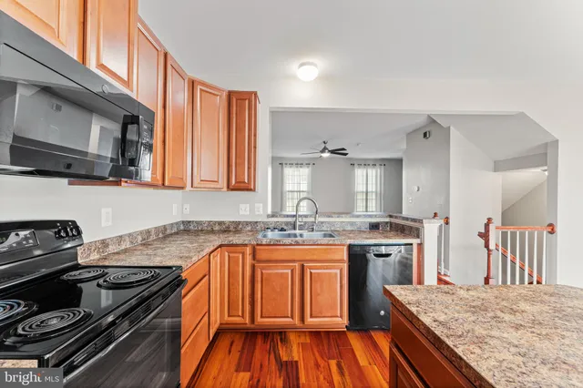 a kitchen with a stove and a sink