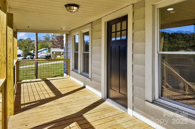 a view of a living room and front door