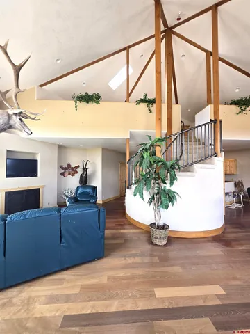 a view of living room with furniture and a potted plant