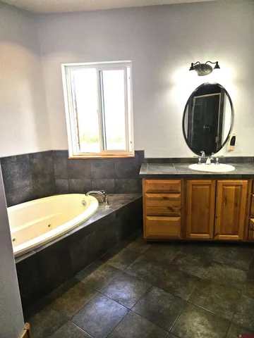 a bathroom with a bathtub and a sink