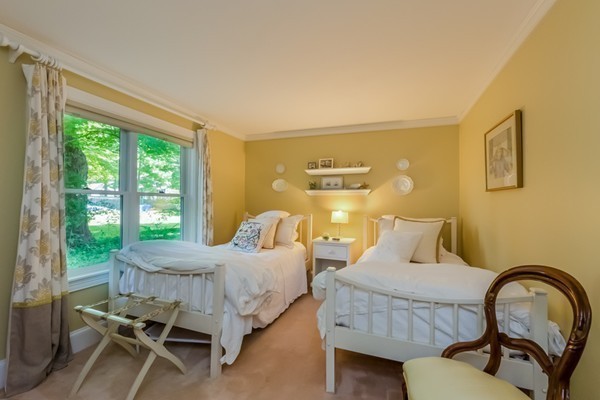 595 Bay Road Hamilton, MA 01982 - Photo 13 of 30 a bedroom with a bed and a large window