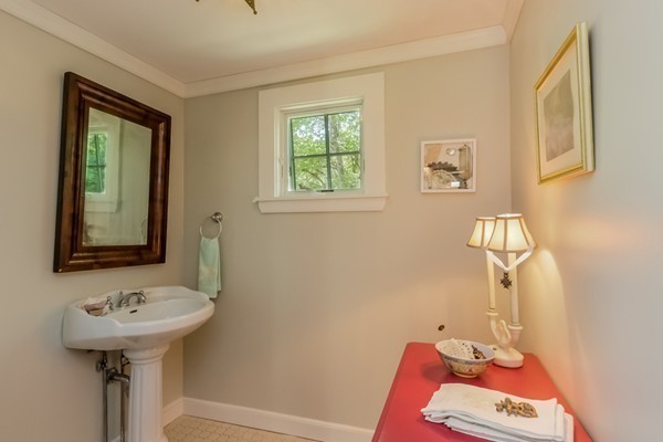 595 Bay Road Hamilton, MA 01982 - Photo 15 of 30 a bathroom with a sink toilet and a mirror