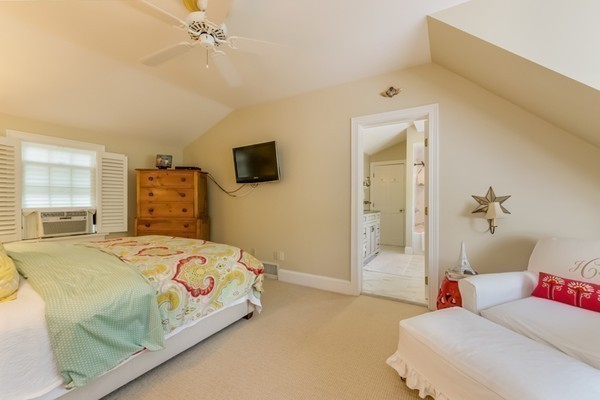 595 Bay Road Hamilton, MA 01982 - Photo 18 of 30 a bedroom with a bed and wooden floor