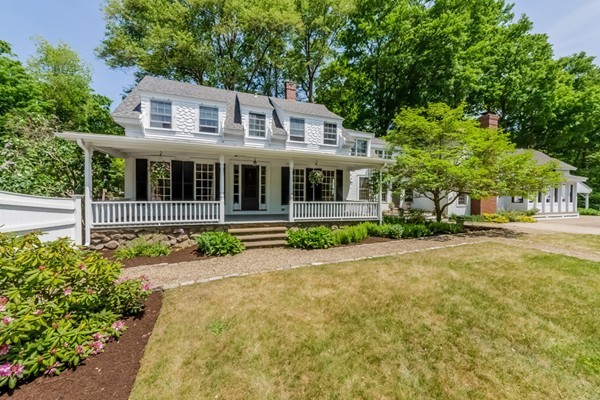 595 Bay Road Hamilton, MA 01982 - Photo 2 of 30 a front view of a house with a garden