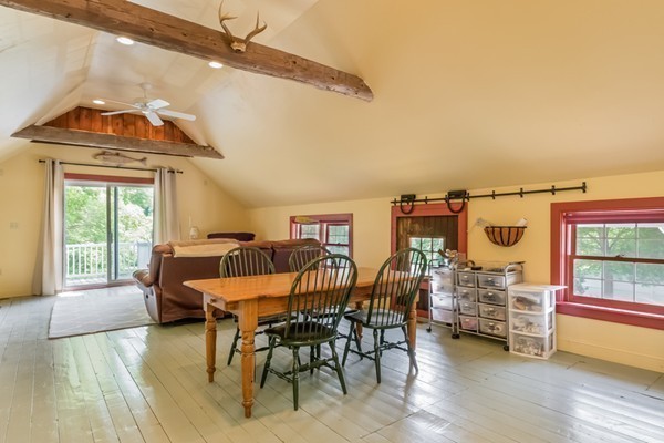 595 Bay Road Hamilton, MA 01982 - Photo 24 of 30 a view of a dining room with furniture window and wooden floor