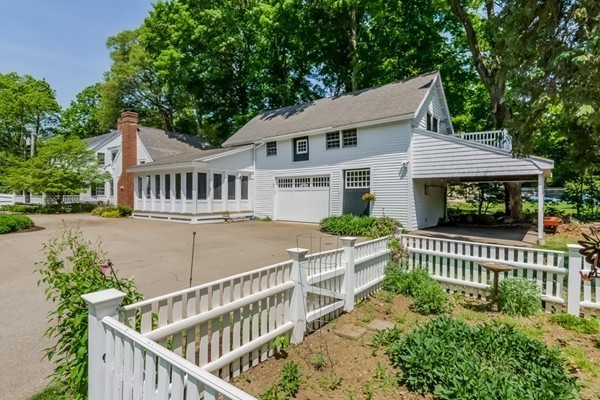 595 Bay Road Hamilton, MA 01982 - Photo 25 of 30 a view of house with a deck and a garden