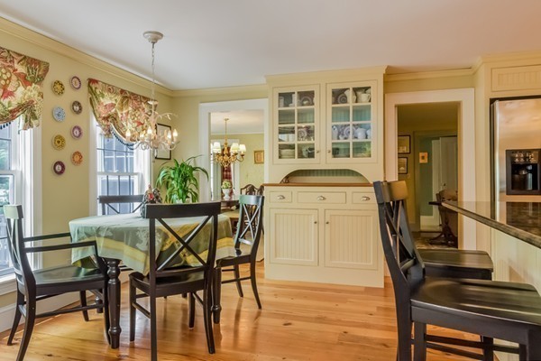 595 Bay Road Hamilton, MA 01982 - Photo 4 of 30 a view of a dining room with furniture and wooden floor