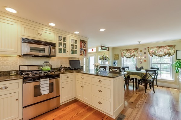 595 Bay Road Hamilton, MA 01982 - Photo 5 of 30 a kitchen with stainless steel appliances granite countertop a stove and cabinets