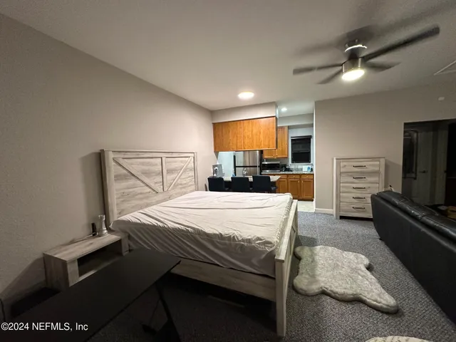 a bedroom with a bed and furniture