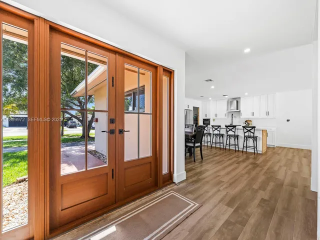 a view of a living room and a floor to ceiling window
