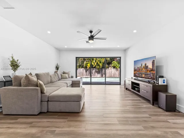 a living room with furniture fireplace and flat screen tv