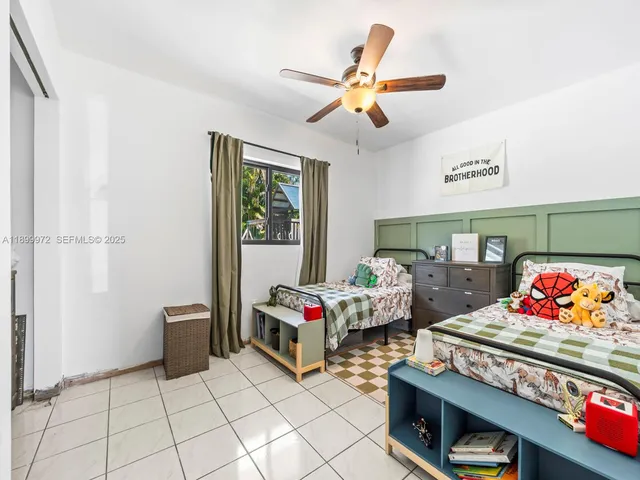 a bedroom with furniture and window