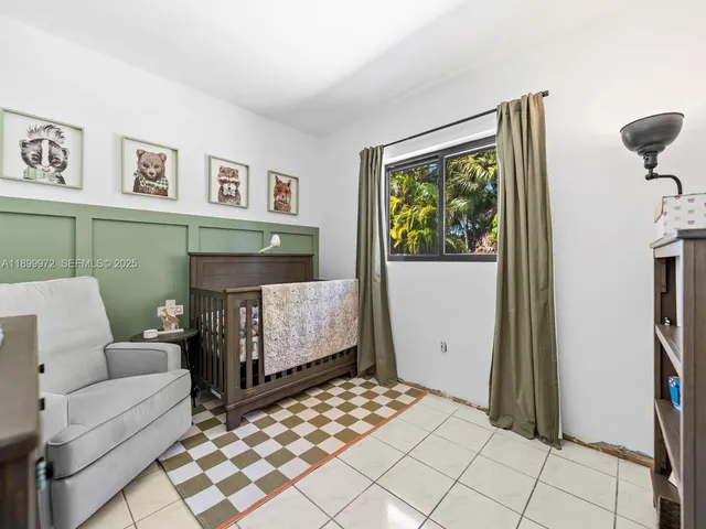 a living room with a couch and a window