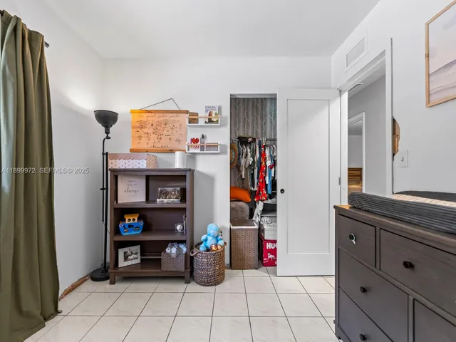 a room with furniture and a flat screen tv