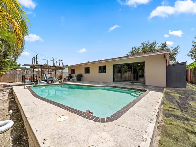 a view of a swimming pool with a patio