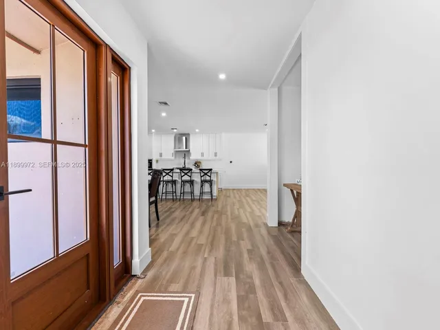 a view of a living room with a large window