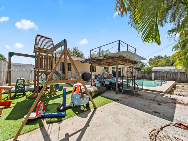 a view of a chairs and table in the patio