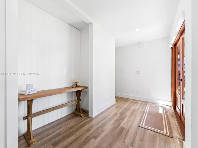 a view of room with window and hardwood floor