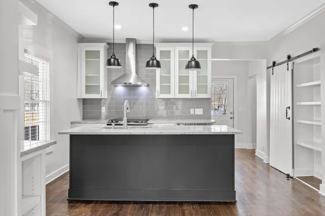 a view of a workspace with furniture window and wooden floor