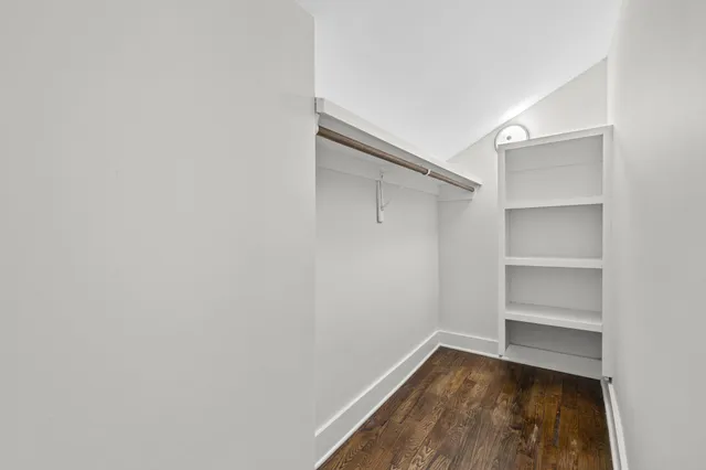 an aerial view of residential houses with outdoor space and river