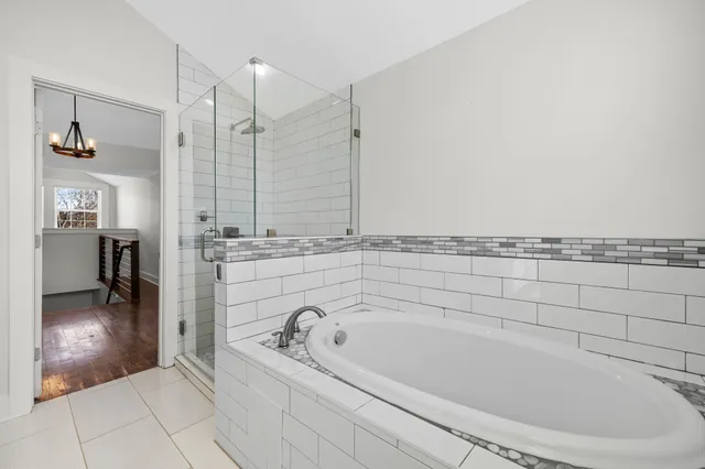 an aerial view of residential houses with outdoor space and mountain view