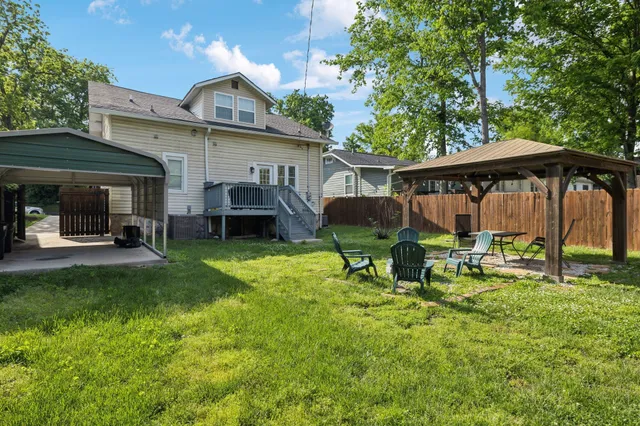 an aerial view of residential houses with outdoor space and river